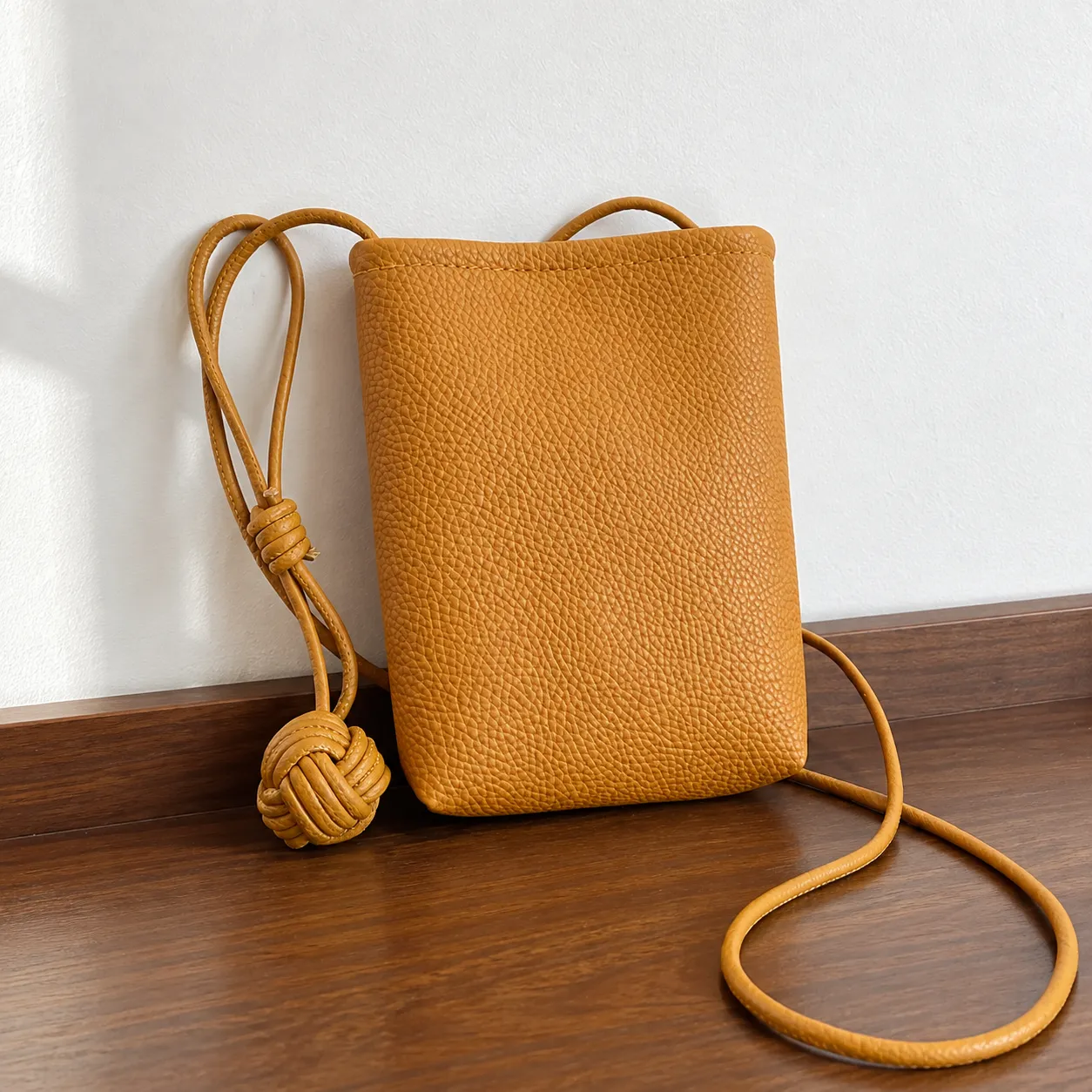 Edie Phone Pouch - lead view; styling objects excluded
